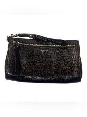 Coach Black Pebbled Leather Wristlet featuring silver hardware and a top zipper.